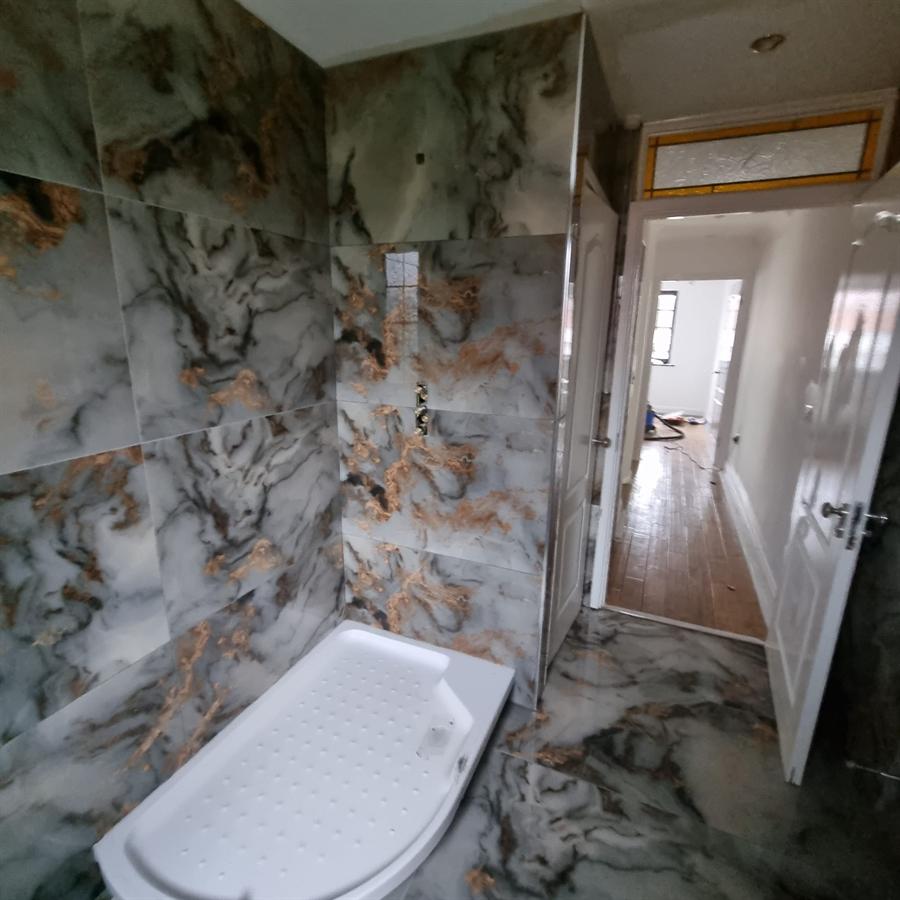 Bathroom renovation project — marble tiled shower and floor, Milton Keynes