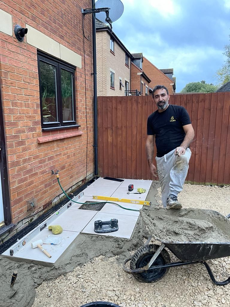 Caliks Decoration team at work — patio installation, Milton Keynes